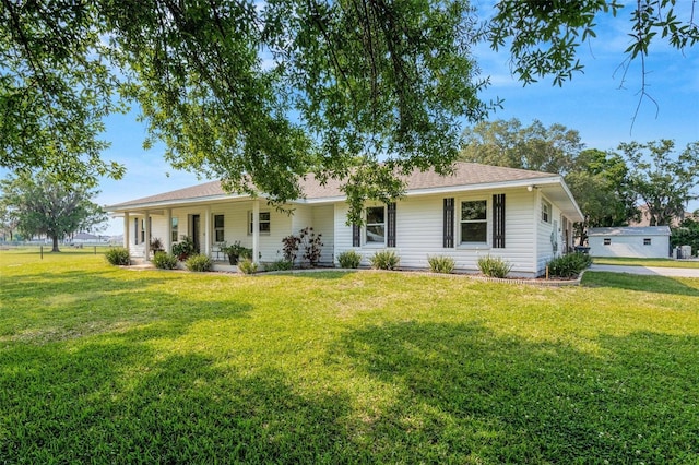 ranch-style home with a front lawn and a porch