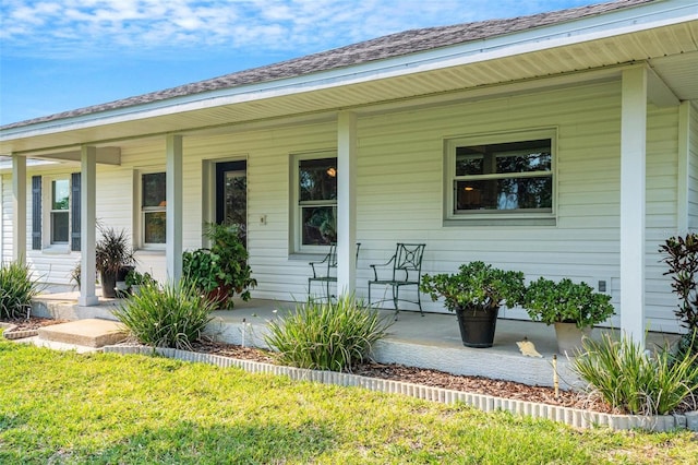 entrance to property featuring covered porch