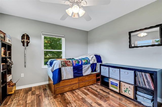 bedroom with ceiling fan and wood-type flooring