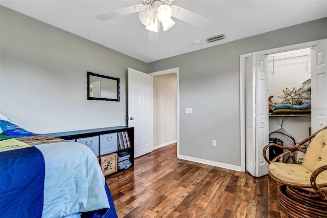 bedroom with ceiling fan, dark hardwood / wood-style floors, and a closet