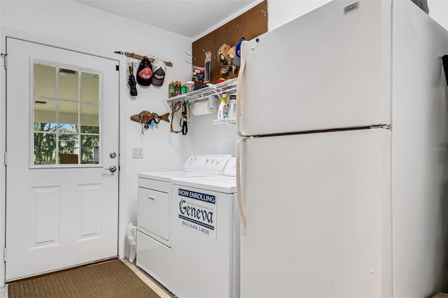 laundry room with independent washer and dryer