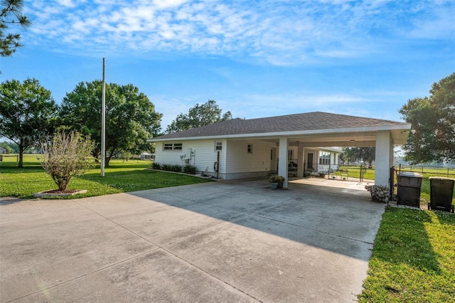 ranch-style house with a front lawn and a carport