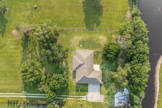 birds eye view of property with a rural view and a water view