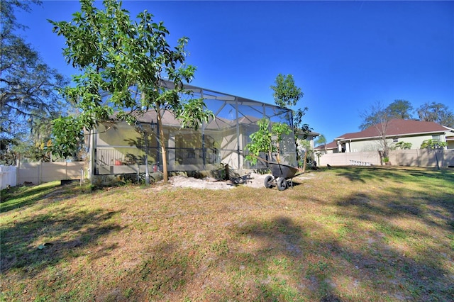 view of yard featuring glass enclosure