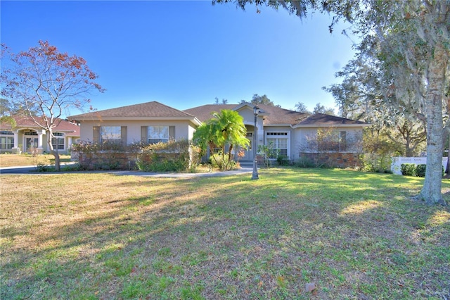 ranch-style house with a front yard