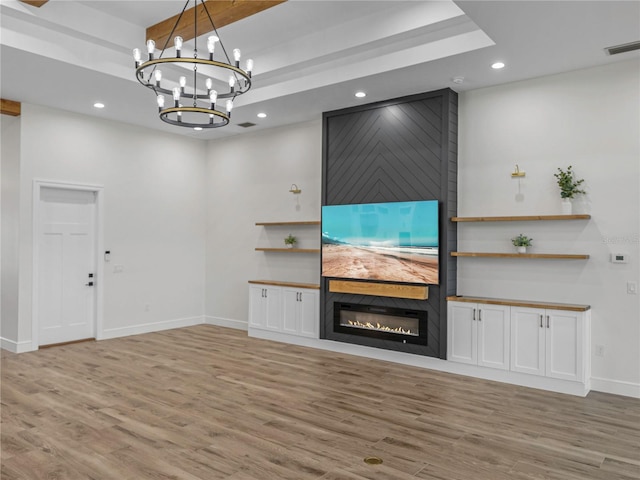2728 Sunrise Landing Ln, Lakeland, FL 33812 - unfurnished living room with a large fireplace, light wood-style floors, a chandelier, baseboards, and recessed lighting