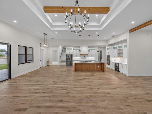 2728 Sunrise Landing Ln, Lakeland, FL 33812 - kitchen featuring beverage cooler, open floor plan, stainless steel fridge, a chandelier, and recessed lighting