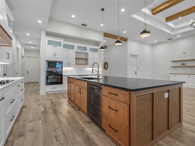 2728 Sunrise Landing Ln, Lakeland, FL 33812 - kitchen with black appliances, open shelves, a sink, an island with sink, and recessed lighting