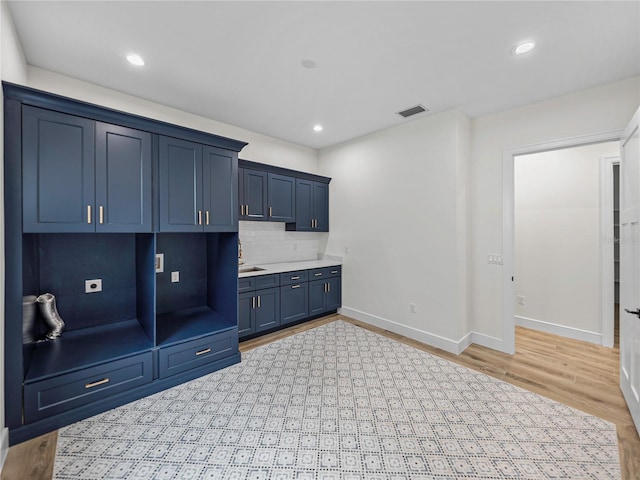 2728 Sunrise Landing Ln, Lakeland, FL 33812 - mudroom with baseboards, light wood-style floors, and recessed lighting