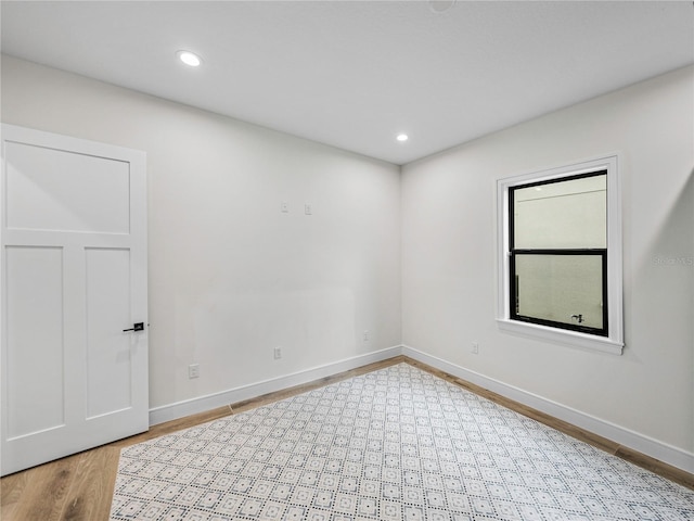 2728 Sunrise Landing Ln, Lakeland, FL 33812 - spare room with baseboards, light wood-style flooring, and recessed lighting