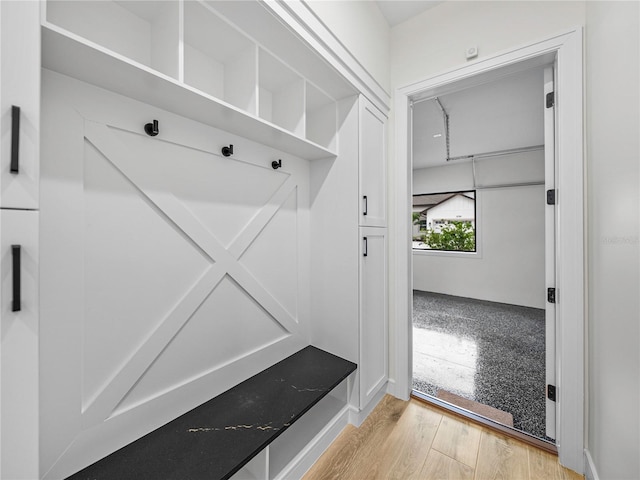 mudroom with light hardwood / wood-style flooring