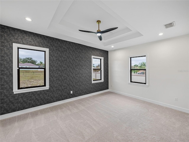 2728 Sunrise Landing Ln, Lakeland, FL 33812 - unfurnished room featuring a raised ceiling, carpet flooring, healthy amount of natural light, a ceiling fan, and recessed lighting