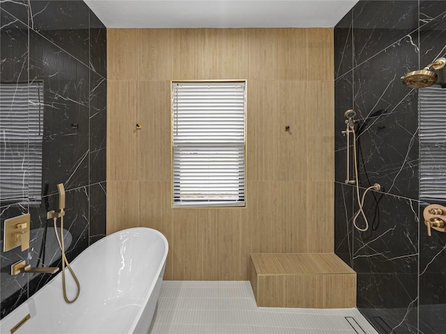 2728 Sunrise Landing Ln, Lakeland, FL 33812 - full bathroom featuring a freestanding tub and a tile shower
