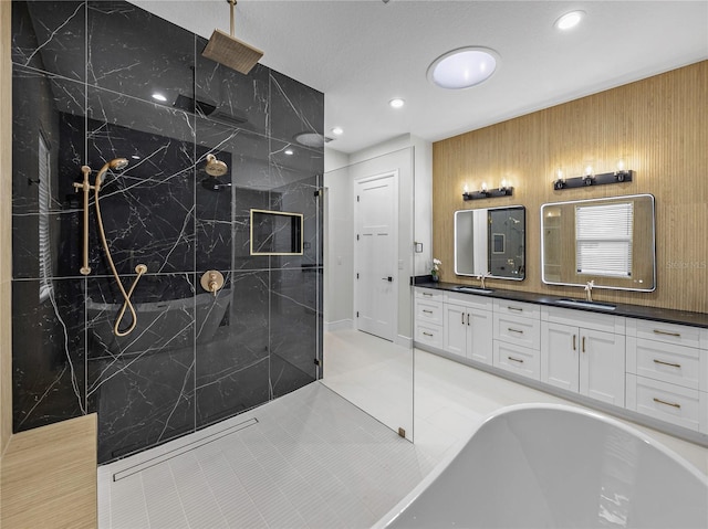 2728 Sunrise Landing Ln, Lakeland, FL 33812 - full bath featuring double vanity, a marble finish shower, a soaking tub, recessed lighting, and tile patterned flooring