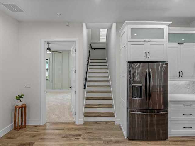 2728 Sunrise Landing Ln, Lakeland, FL 33812 - staircase with wood finished floors, baseboards, and ceiling fan