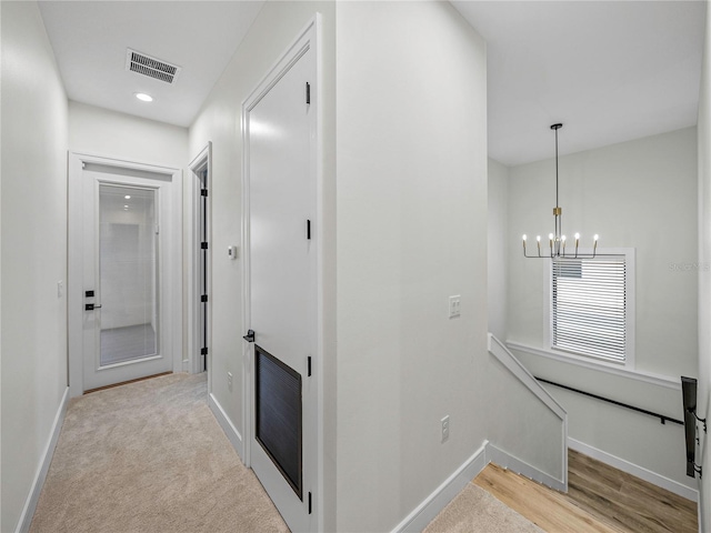 2728 Sunrise Landing Ln, Lakeland, FL 33812 - corridor featuring an upstairs landing, a chandelier, baseboards, and recessed lighting