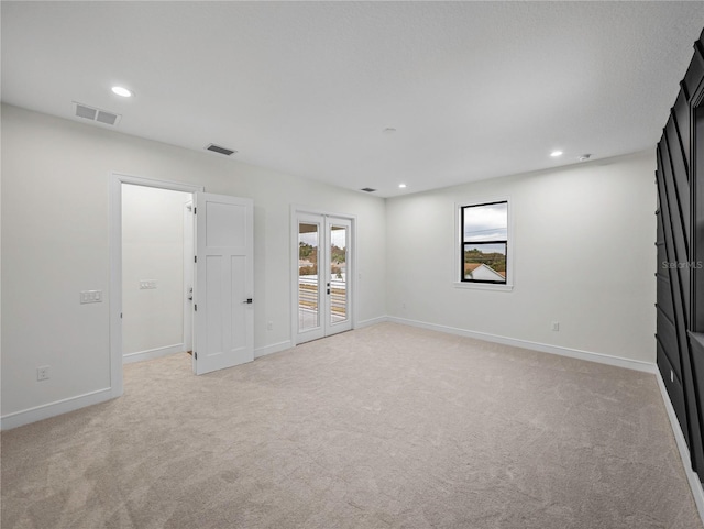 2728 Sunrise Landing Ln, Lakeland, FL 33812 - unfurnished bedroom featuring access to outside, multiple windows, light carpet, baseboards, and recessed lighting