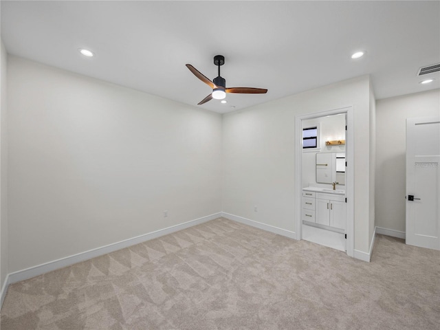 2728 Sunrise Landing Ln, Lakeland, FL 33812 - unfurnished bedroom featuring light carpet, a sink, recessed lighting, baseboards, and ensuite bathroom