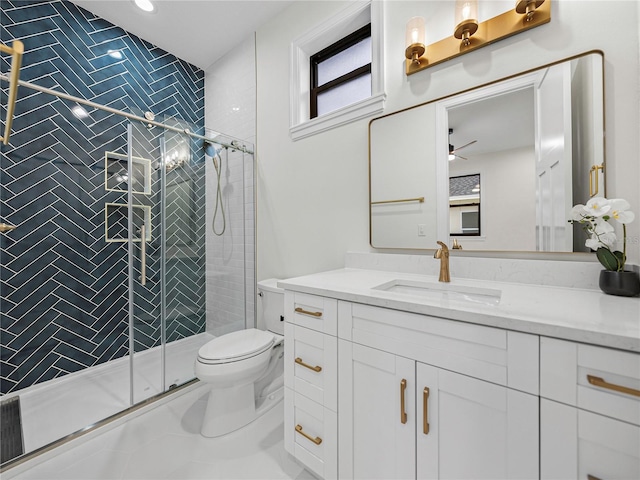 2728 Sunrise Landing Ln, Lakeland, FL 33812 - bathroom featuring vanity, toilet, a stall shower, and a ceiling fan