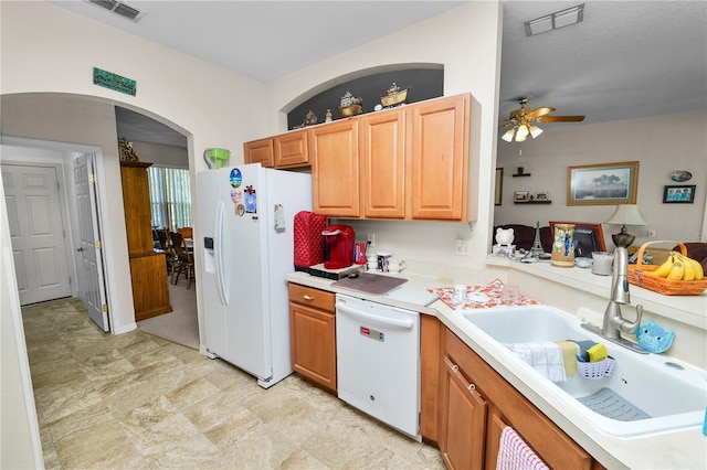 kitchen with ceiling fan, white appliances, and sink