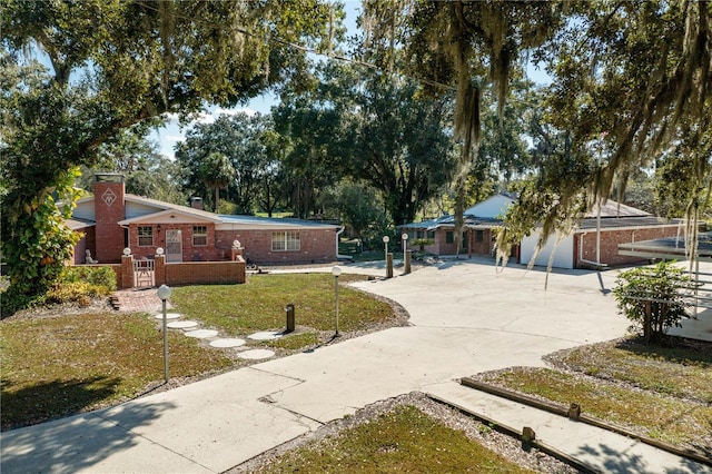 view of front of home featuring a garage and a front lawn