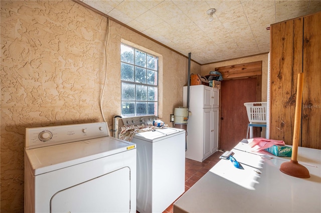 laundry area featuring separate washer and dryer and crown molding