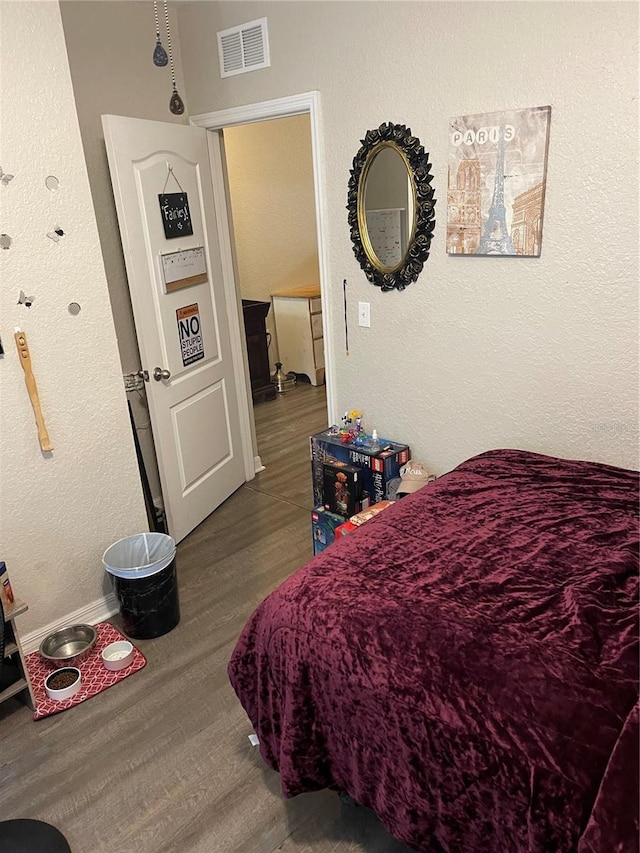 bedroom featuring hardwood / wood-style floors