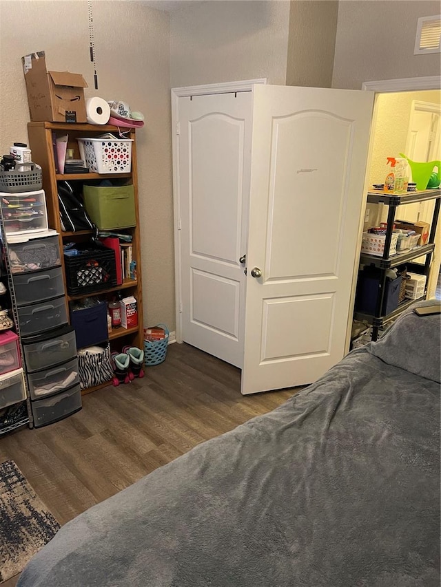 bedroom with hardwood / wood-style floors