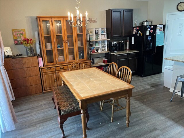 dining room featuring an inviting chandelier and wood finished floors