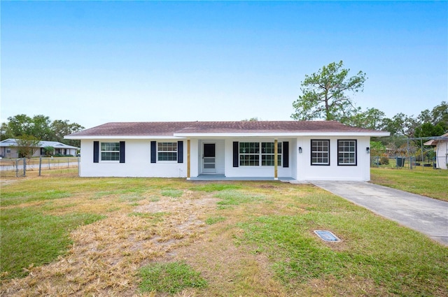 single story home with a porch and a front yard