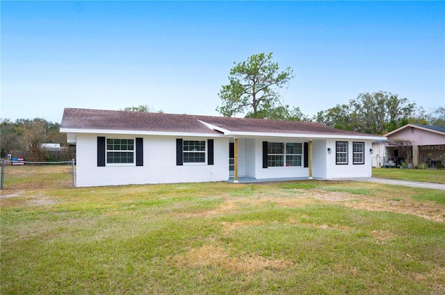 ranch-style home with a front lawn and a porch