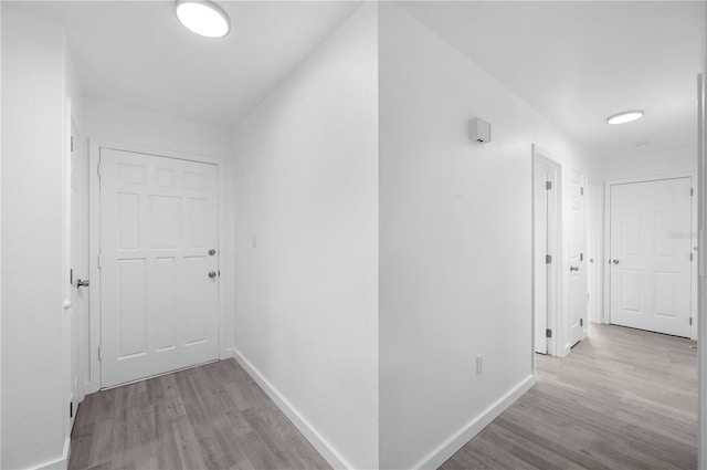 hallway featuring light hardwood / wood-style flooring