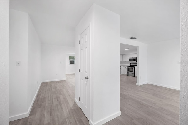 hallway featuring light hardwood / wood-style flooring