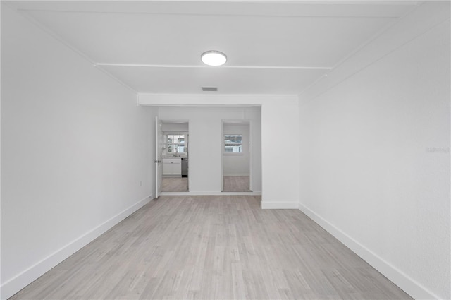 unfurnished room featuring light wood-type flooring