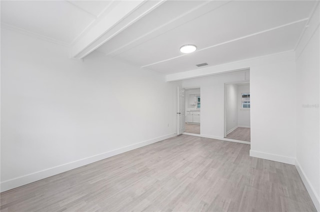 spare room featuring light hardwood / wood-style flooring