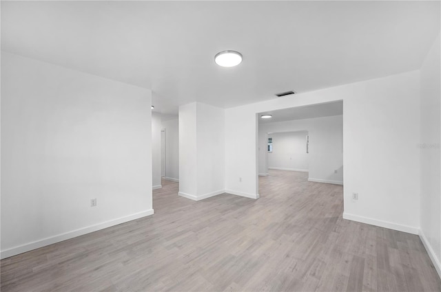 spare room featuring light wood-type flooring