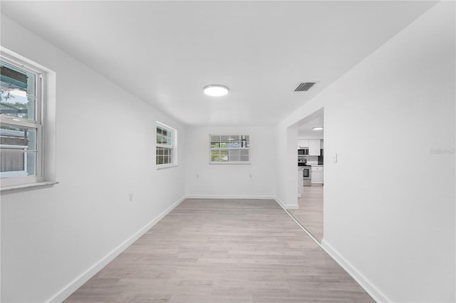 corridor featuring light wood-type flooring