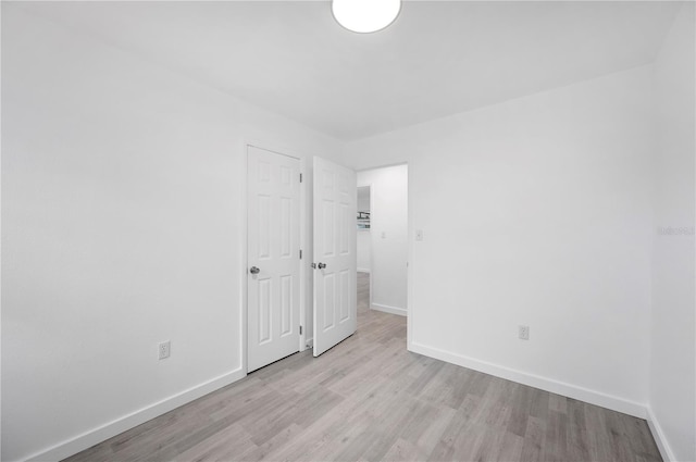 spare room featuring light hardwood / wood-style floors