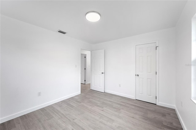 unfurnished bedroom featuring light wood-type flooring