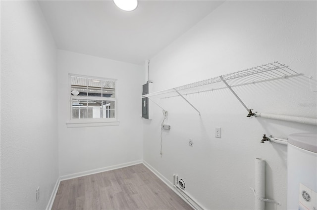 laundry area with electric dryer hookup, gas dryer hookup, and light hardwood / wood-style flooring