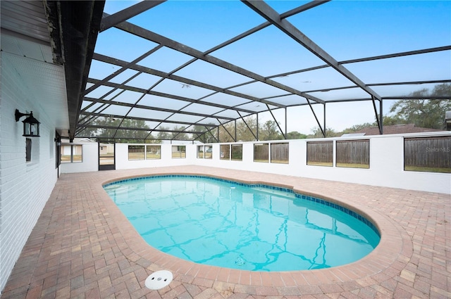 view of pool featuring a lanai and a patio