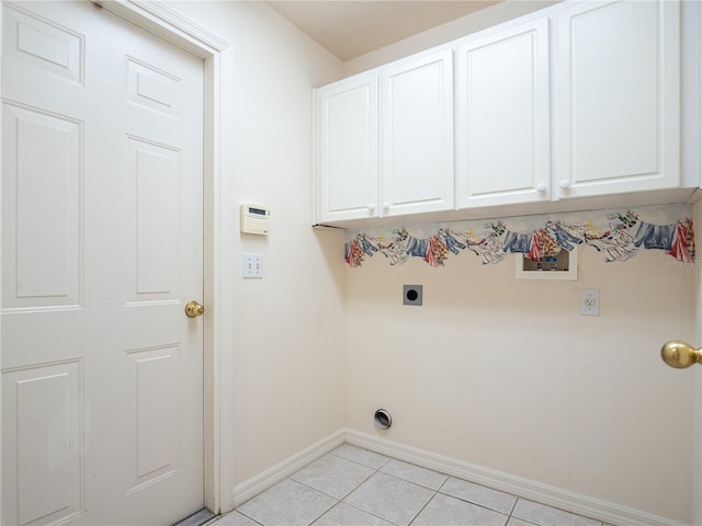 laundry area with cabinets, light tile patterned floors, hookup for a washing machine, and electric dryer hookup