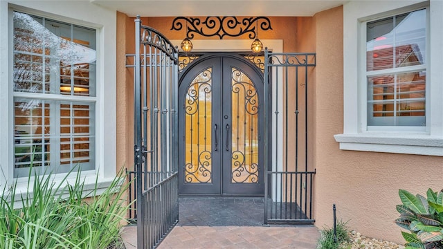 entrance to property featuring french doors