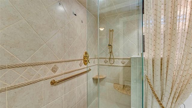 bathroom with a shower with shower door