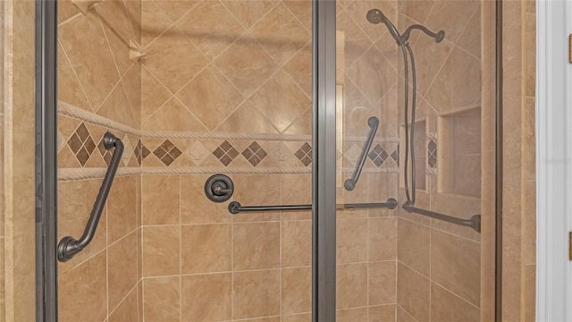 details featuring a shower with shower door