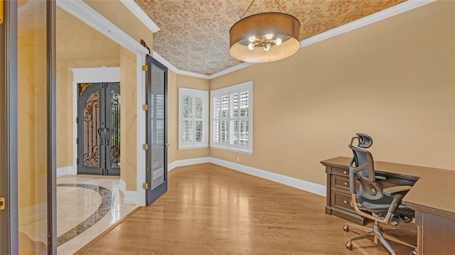 unfurnished office featuring light hardwood / wood-style flooring, ornamental molding, and a chandelier