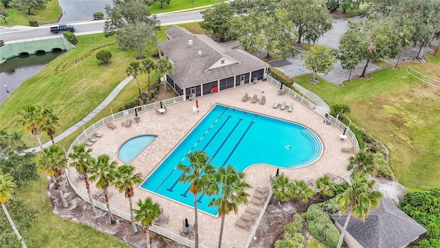 view of pool with a water view