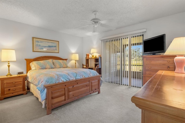 bedroom with access to exterior, light carpet, ceiling fan, and a textured ceiling