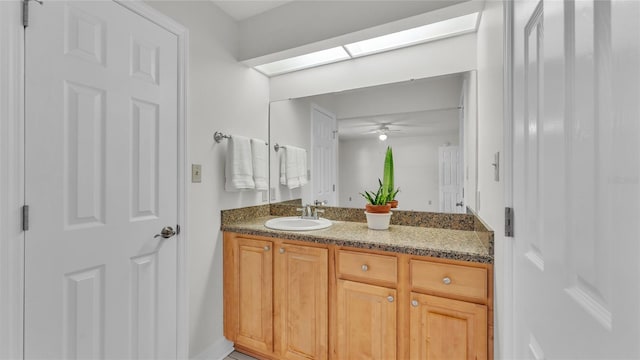 bathroom with vanity and ceiling fan