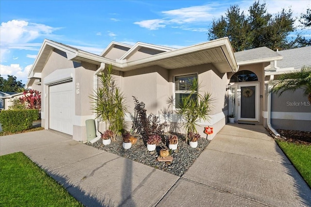 view of front of property with a garage